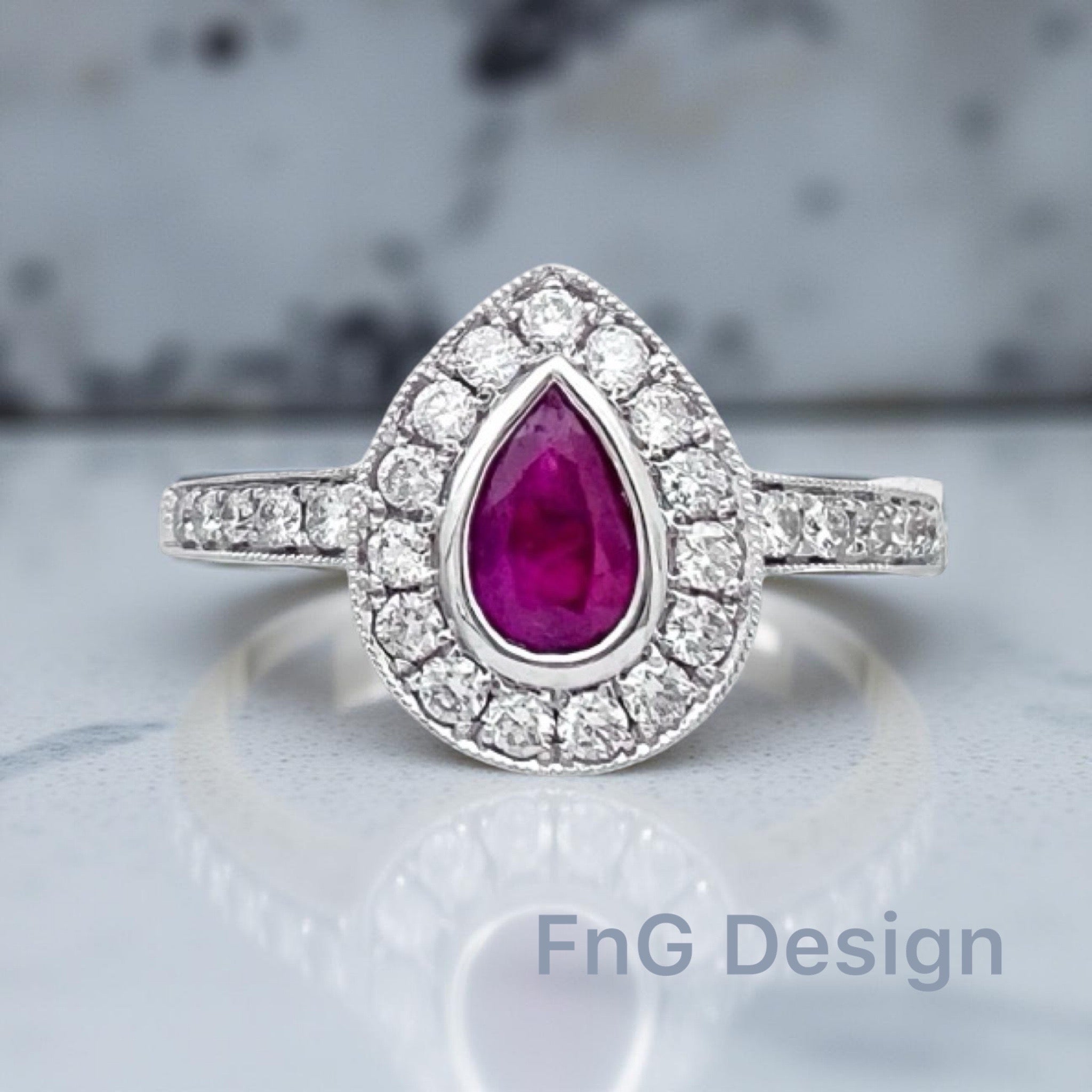0.26 Carats Diamond VS2 & 0.39 Carats Red Ruby Pear Shape Set In 14 Karat White Gold Ring